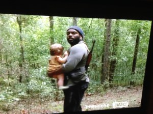 Somebody get that man an Ergo baby carrier!