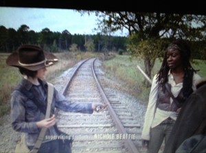 Carl shares the prize, the last stale-ass Big Kat bar...sweet boy loves him some Michonne