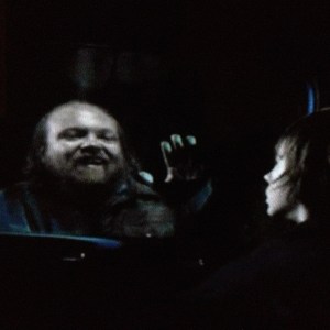 Meanwhile, at the car, a nightmare comes a knockin' for poor Carl...