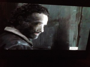 Rick In Charge cracks the door of the train car, peers outside, then turns to the gang...