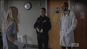 We can see in the body language of Doc and Dawn who the dominant one is...his hands are stuffed into the pockets of his lab coat, while her hands are loosely hooked at her belt, ready...