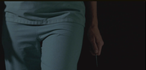 Beth walks down the hallway, scissors ready, ready to take down Doc Edwards first, then anyone else who comes for her...until she sees, being wheeled in on a stretcher...