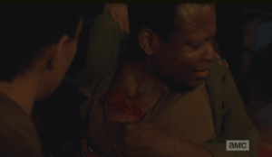 Bob pulls his shirt away, showing Sasha, and the gang, the walker bite on his shoulder.