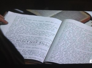 Carol finds Gabriel's office, with a journal book containing handwritten scripture...THOU SHALT NOT KILL.