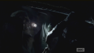 ...Beth fights it off him with Gorman's flashlight.