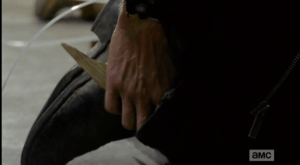 Rick pulls his shiv out of his boot, grips it, and waits.