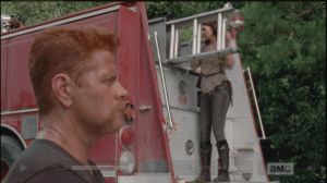 ...before going to the back of the fire truck and getting a ladder, while Abraham is still kneeling and being weird.