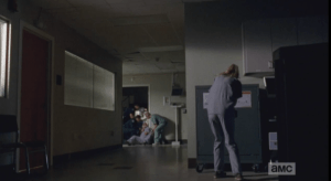 ...who fakes a coughing attack, distracting the guards while Beth unlocks the meds cabinet and finds the vial of epinephrine...