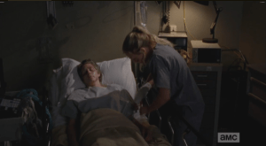Beth sneaks into Carol's room and injects the meds into Carol's I.V.