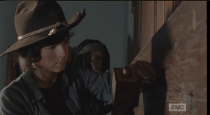 Carl and Michonne board up the church, sealing themselves, Judith, and Father Gabriel in, safe and tight...in theory.
