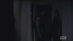 Daryl and Carol silently register the import of this awful sight. (Cried every time I watched this scene...this shit is why I drink, people.)