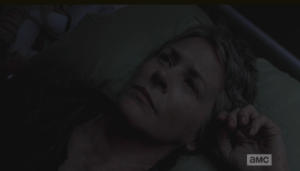 Carol turns and heads back to the little room with the bunk beds, troubled, and finally gets some sleep.