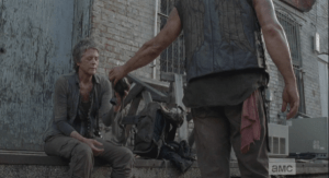 They stop to rest, and Carol is noticably hurting, although she tries to play it off. Daryl blames himself, and Carol jokes,