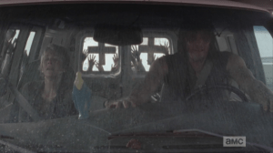 Daryl and Carol brace themselves, hands on each other's, so sweet.