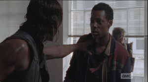 Daryl grabs him, asks him if there was a blond girl there. Noah's eyes widen