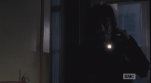 Daryl looks down at the book, asks Carol, with a hitch in his voice,