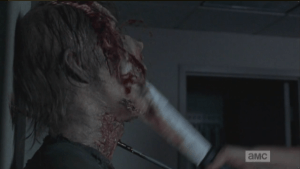 Daryl does the walker a solid machete rekill, shutting it the hell up.