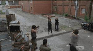 Looking majorly fine, Deputy Rick Grimes talks the cops down, telling them weapons down, hands up,