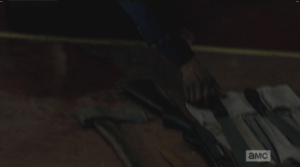 When Gabriel reaches out and selects the machete, Carl commends him on his choice, but adds that Gabriel isn't holding it right, that sometimes you have to drive the machete up (and Carl demonstrates the upward driving motion) when the walker's skull isn't so soft...at this, Gabriel swallows hard, excuses himself to go lie down.