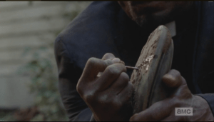 After giving a sneaky look around, Gabriel goes to leave, and promptly steps on a nail...karma! He pulls the nail out and hobbles away, through the woods.