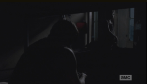 As Carol weighs all this, still at the window, Daryl says,