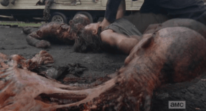 In a moment of goretastic ingenuity, Daryl grabs a walker's skull like a bowling ball and smashes it against Officer Baldy's head.