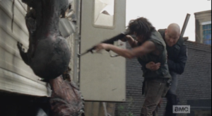 Oooff! Officer Baldy tackles Daryl...