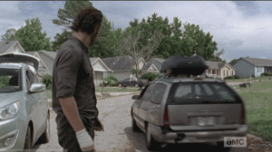 Rick watches Carol drive off