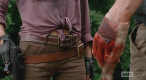 As Abraham steps to Eugene's fallen form, Rosita steps in between him and Eugene, her hand on her gun, if needed.  Abraham looks down a this bloody hand...