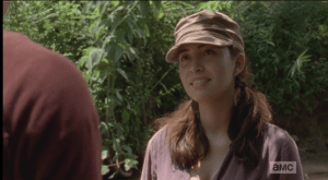 Disarmed, Rosita takes just a moment before smiling, agreeing,
