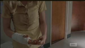 We watch as Beth slips the scissors into her cast, just in case...