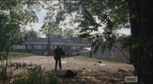 ...who, hobbling and tripping along the way, leads the walkers through the woods...