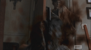 ...and Gabriel's machete makes its first kill, as Machete Walker falls right into the sharp blade, slicing her head in two. (Bravo, Nicotero & Co.!)