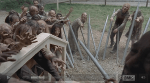 Thankfully for Gabriel, the Morgan-style spikes that Daryl and Tyrese fashioned from the organ pipes hold the walkers off, buying him a couple of minutes' worth of time...
