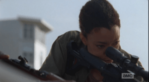 Sasha peers through the rifle scope, refocusing on the task at hand.
