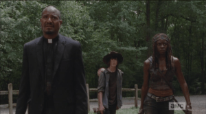 As the walkers begin to break down the doors, Gabriel, Michonne, and Carl back up...Carl asks,