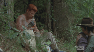 Abraham sniffs the bottle, then takes a drink.
