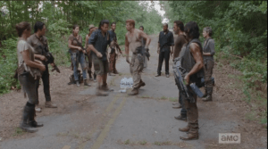 Abraham steps quickly forward and slaps the bottle right out of Eugene's hand, sending the water flying. Eugene looks like he is about to cry, and Rick tells him, gently, that they can't take the risk.