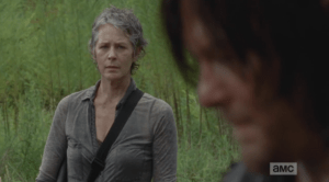 Carol looks at Daryl.