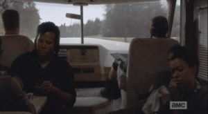 In the front of the RV, Eugene is teaching the rules to Seven Card Stud. Tara, I think, asks him a