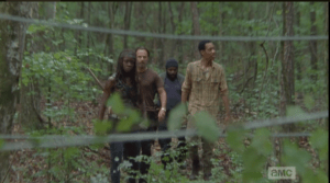 gang approaches barb wire fencing
