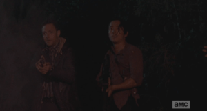 Glenn and Aaron have come to save the day. Aaron holds up his hands, offers for Rick to tie him up again, if he needs to, but please hurry...methinks Aaron secretly is beginning to enjoy this!