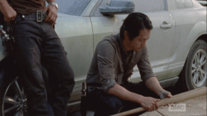 This image, of Glenn holding this baseball bat, is considered a potential 