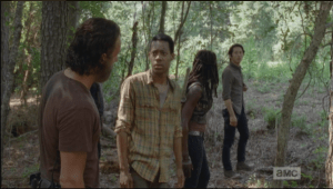 Glenn turns to the group, says,