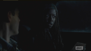 Michonne knows immediately that Aaron is lying, and looks to the front seat, asks Rick, 