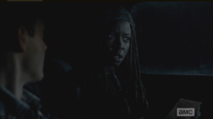 Michonne knows immediately that Aaron is lying, and looks to the front seat, asks Rick,