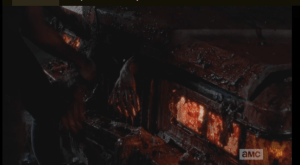 michonne pulls walker parts out of the car's hood