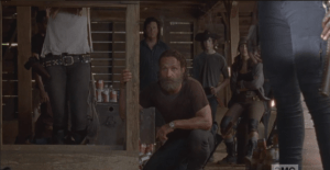 Rick crouches down, looks right at Aaron.