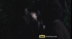 rick fires at the walker