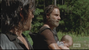 Rick pulls Judith up a little closer to him. 